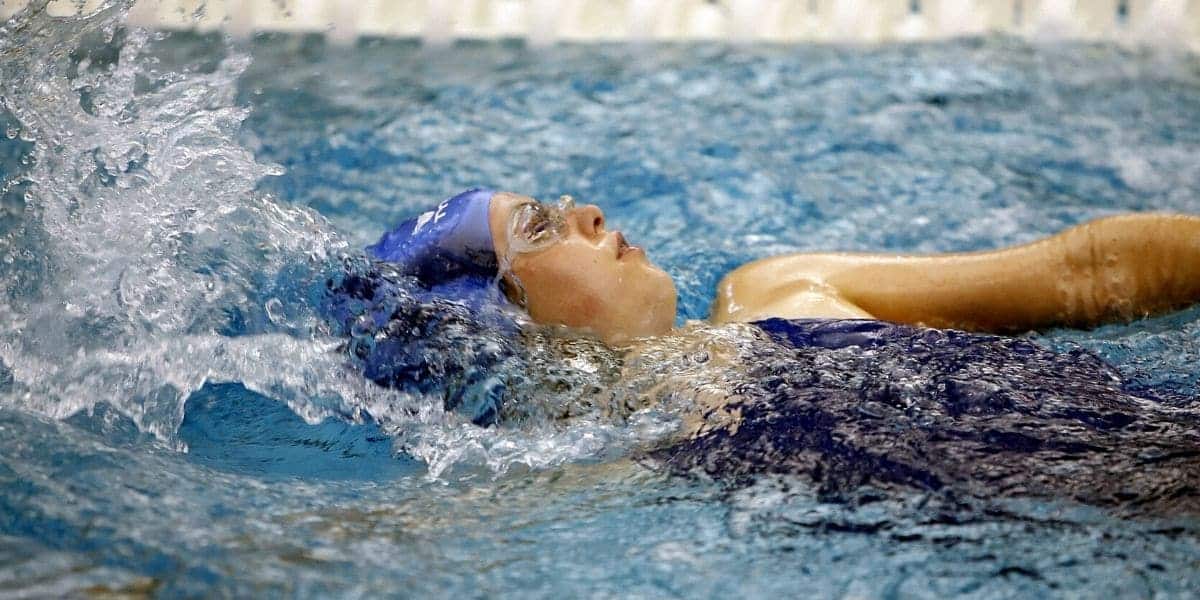 backstroke swimmer with tech suit