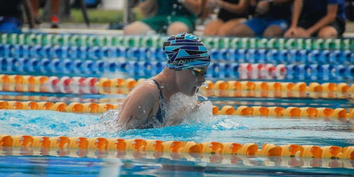 Swimmer wearing a TYR tech suit